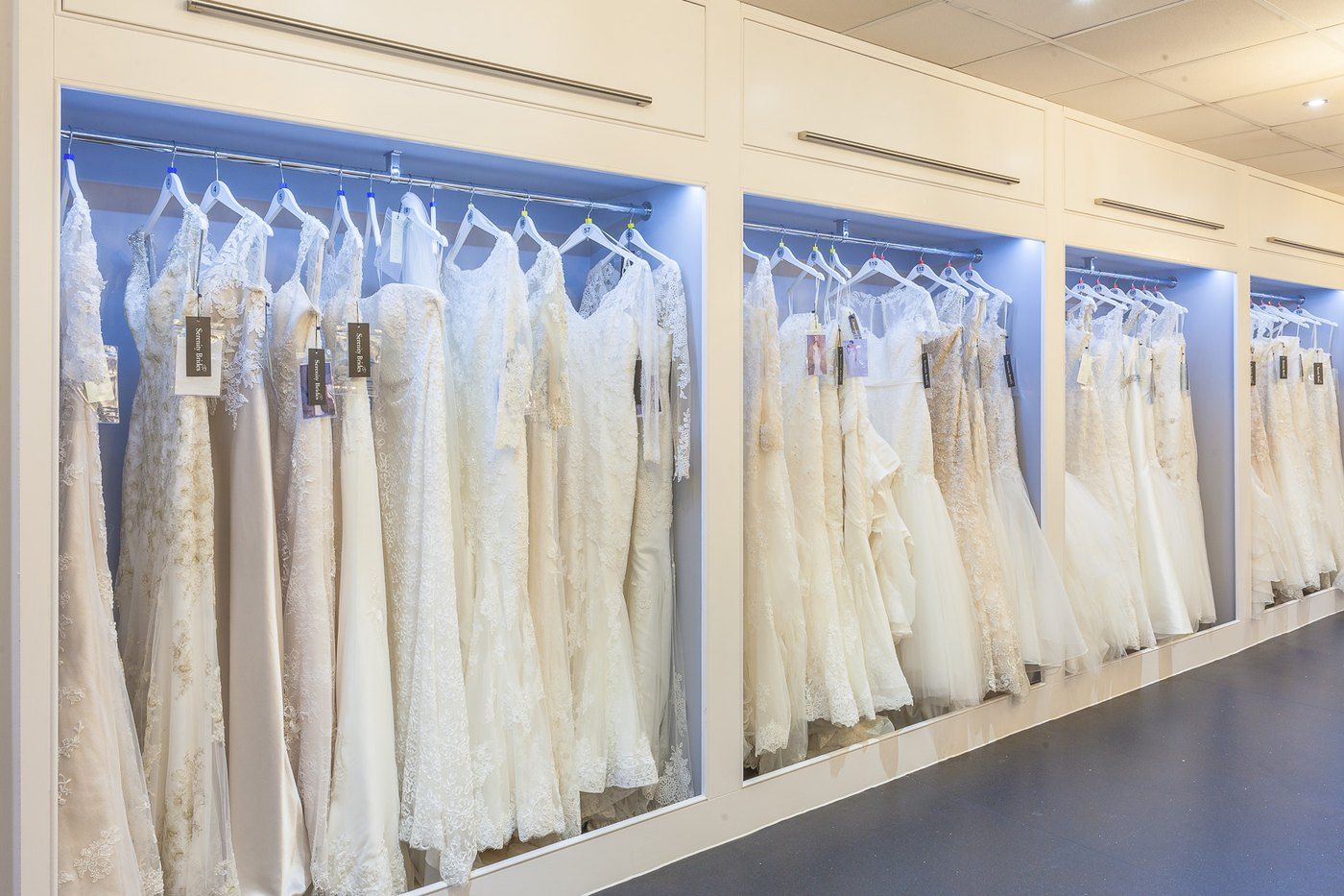 Rails of bridal gowns at Serenity Brides