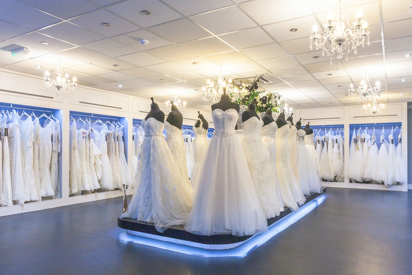 The Serenity Brides showroom, with gowns on a lit plinth
